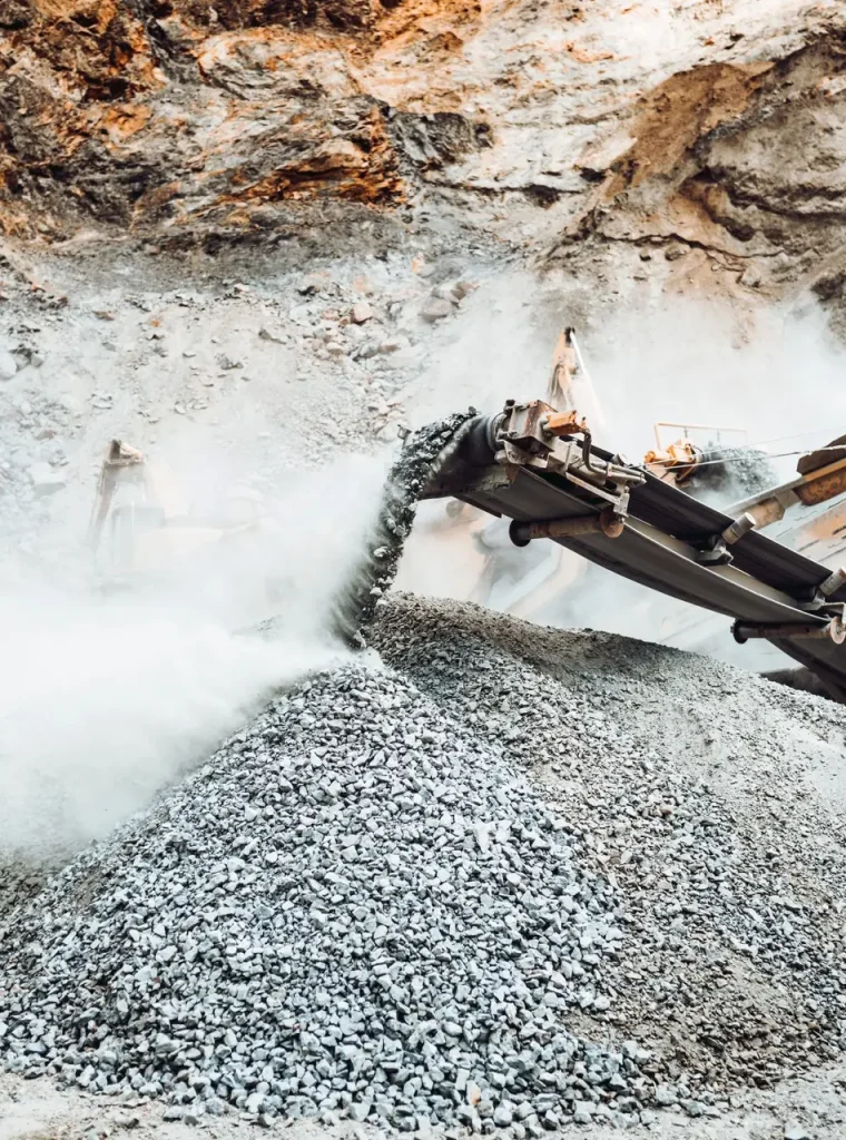 Details of stone breaker at industrial rock and ore quarry. Granite rocks crusher